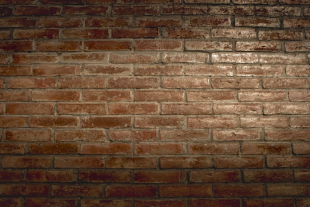 Old brick wall. Horizontal wide brick wall background. Vintage house facade.の写真素材