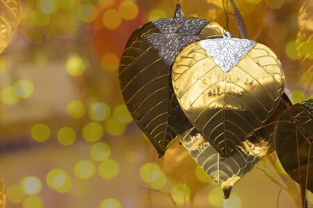 Golden leaf on gold bokehの写真素材