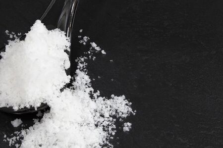 Salt flower on the black stone floor.