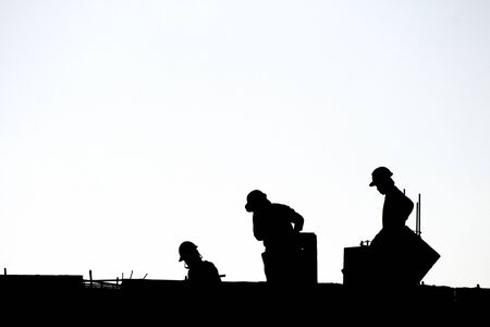 Silhouette workers under construction and construction site.の写真素材