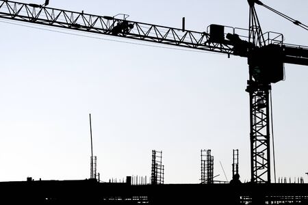 Silhouette workers under construction and construction site.の写真素材