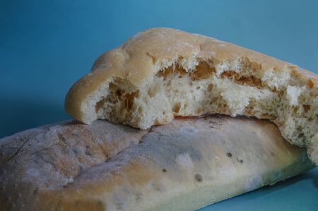 Close up of black fungus on expired organic bread made from wheat flour