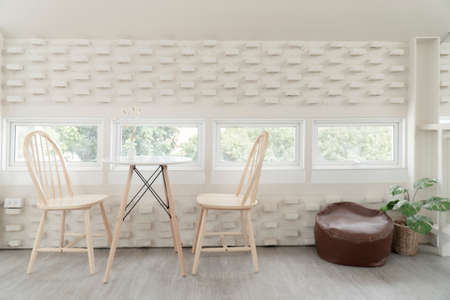Set Of White Wooden Vintage Chairs in white decorative tones.の写真素材