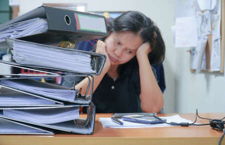 Hard work. Tired unhappy office worker woman.