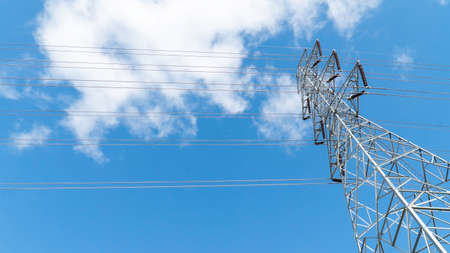 High power electrical pole on a cloudy sky.の写真素材