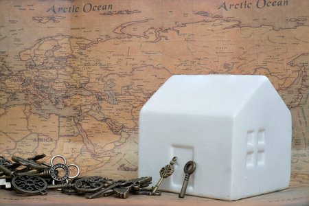 House on the world map with key.の写真素材