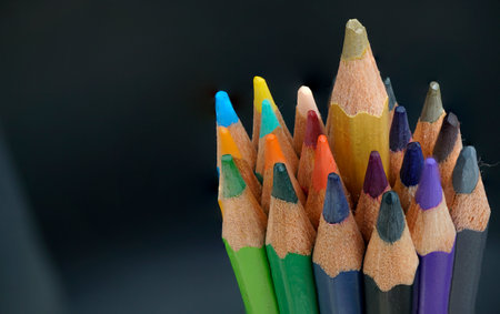 Set of colored pencils on a black backgroundの写真素材