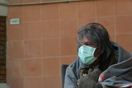 Unidentified poor man with face mask in Kolkata.の写真素材