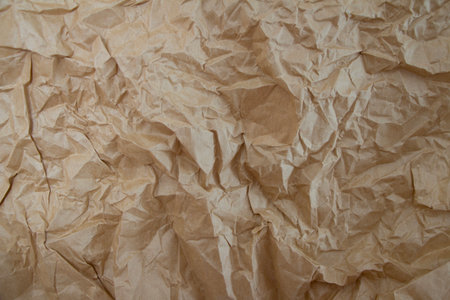 Crumpled brown paper as a background texture. Close up.の写真素材