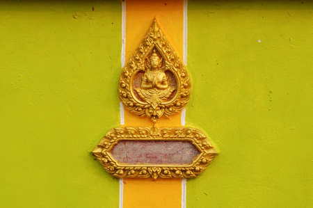The Thai style pattern of golden god is on the wall of the temple at Nakhonpanom,Thailandの写真素材