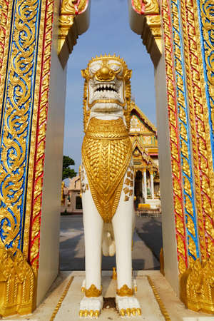 The ancient lion statue at the temple gate in Thailandの写真素材