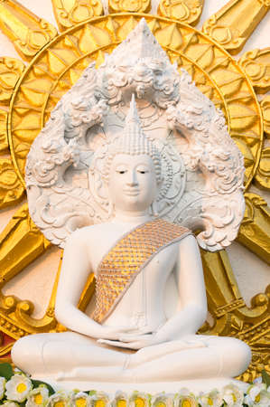 The beautiful white sitting buddha at the public temple in Thailandの写真素材
