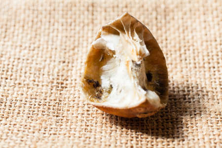 rotten lemon on sackclothの写真素材