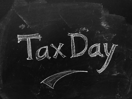 Tax Day handwritten on Blackboard as JPG Fileの写真素材