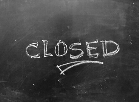 Closed Message handwritten on Blackboard as JPG Fileの写真素材