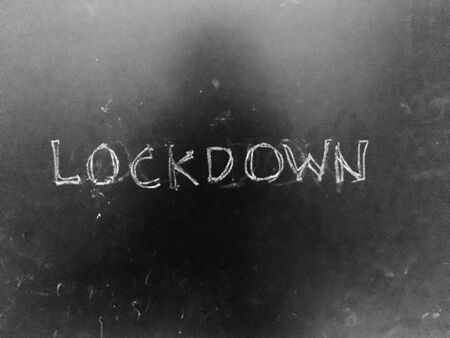 Lockdown handwritten on Blackboard as JPG Fileの写真素材