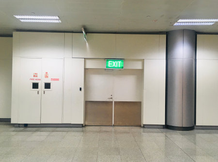 Exit Door with Signage at  Departure Hall of New Terminal Extension at Rajiv Gandhi International Airport - Hyderabad,  India on 11th June 2024のeditorial素材