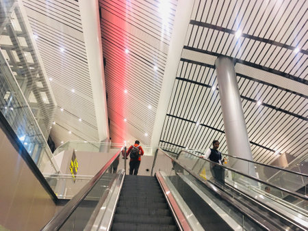 Escalator with metal ceiling at Departure Hall of New Terminal Extension at Rajiv Gandhi International Airport - Hyderabad,  India on 11th June 2024 as JPG Fileのeditorial素材