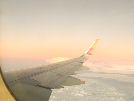 Tourism Aspiration Concept - Sky view of wing from Airplane Window - Stock Image as JPG Fileの写真素材