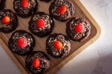 Chocolate cakes with sunflower seeds, chia seeds and sesame seeds. Heart shaped mini cakes.の写真素材