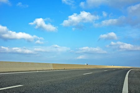 highway and blue cloudy skyの写真素材