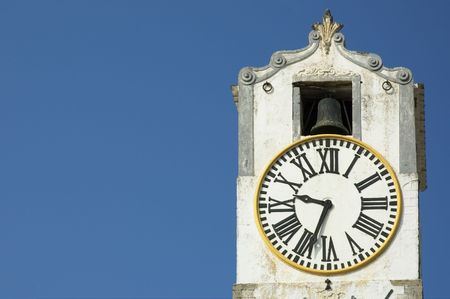 ancient clock over blue sky with space for textの写真素材