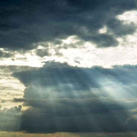 stormy cloud with sun raysの写真素材