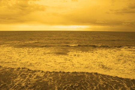 ocean beach in the sunsetの写真素材