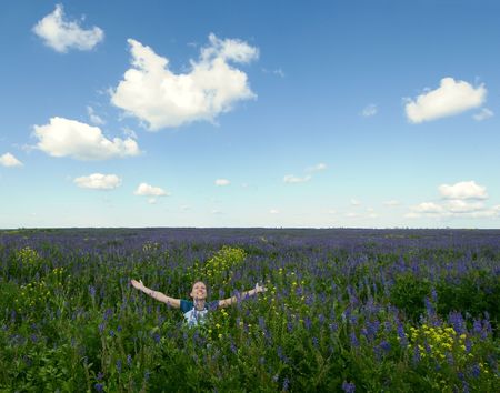 happy girl in the blooming fieldの写真素材