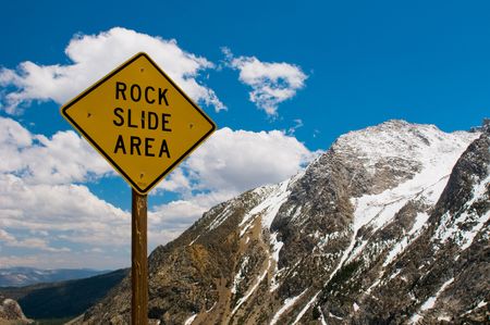 Rock slide area sign in the mountainsの写真素材