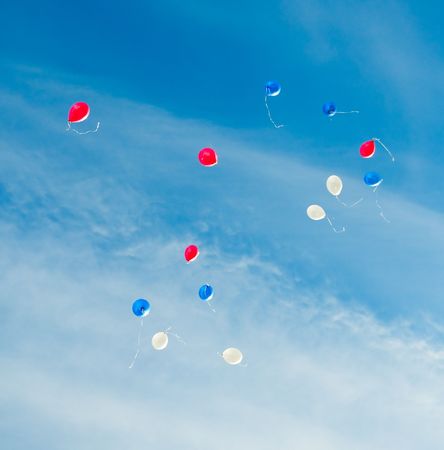toy color baloones in the skyの写真素材