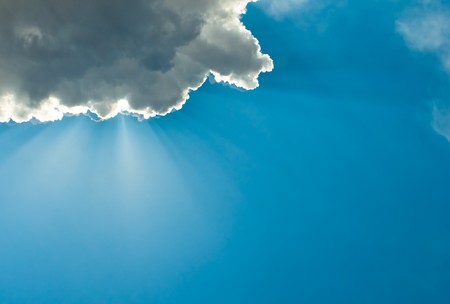 white clouds over deep blue sky background