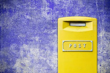 yellow mail-box over grunge backgroundの写真素材