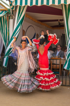 SEVILLE, SPAIN - April, 25: Women performing sevillana dance at the Seville's April Fair  on April, 25, 2012 in Seville, Spainのeditorial素材