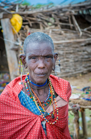 MASAI MARA, KENYA - September, 23: Old Masai woman on September, 23, 2008 in Masai Mara National Park, Kenyaのeditorial素材