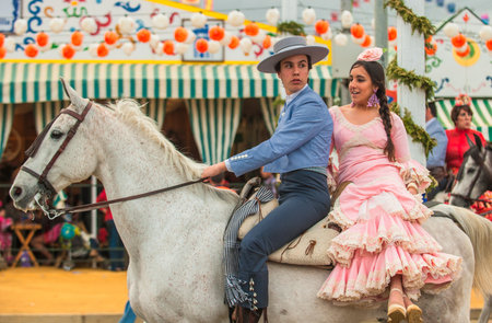 SEVILLE, SPAIN - April, 26: Horse riders at the Seville's April Fair on April, 26, 2012 in Seville, Spainのeditorial素材