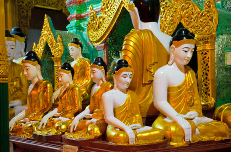 YANGON, MYANMAR - December, 14, 2010: Buddha statue at Shwedagon Pagoda. It is the most sacred Buddhist pagoda for the Burmese. のeditorial素材
