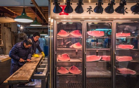 TOKYO, JAPAN - November, 22, 2014: Tuna sellers at Tsukiji, the biggest fish and seafood market in the world.のeditorial素材