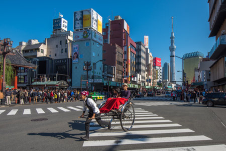 TOKYO, JAPAN - November, 23, 2014: Tokyo sightseeing by rickshaw tour, Asakusa historic districtのeditorial素材