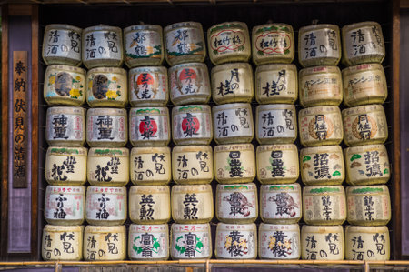 A collection of Japanese sake barrels stacked on top of each other in Heian Shrine, Kyoto, Japanのeditorial素材