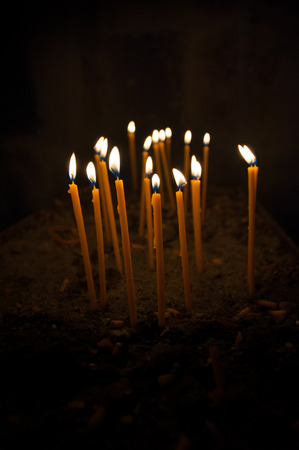 Burning candles over black backgroundの写真素材