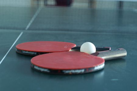 ping pong rackets on a tableの写真素材