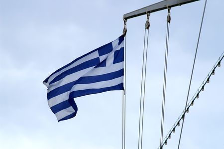 Greece flag on a cruise ship in mediterranean seaの写真素材