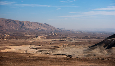 Stone desert tourism hiking in mountains under blue skyの写真素材
