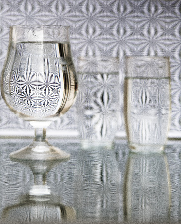 Glass with water refraction and reflection black whiteの写真素材