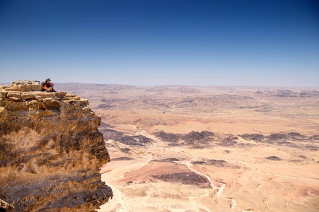 Hiking in stone desert mountain landscape of Israelの写真素材