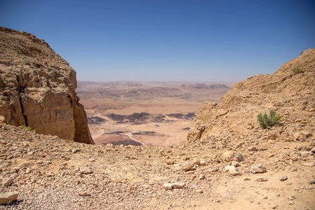 Hiking in stone desert mountain landscape of Israelの写真素材