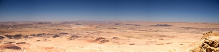 Hiking in stone desert mountain landscape of Israelの写真素材