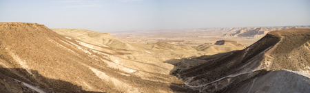 Hiking in stone desert mountain landscape of Israelの写真素材