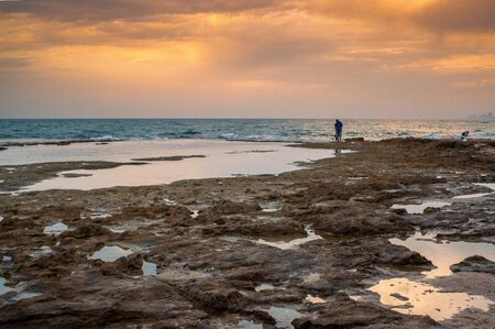 Dramatic clouds under water and windy weather sunsetの写真素材